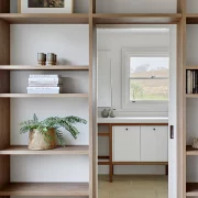 Bookcase wrapped around doorway