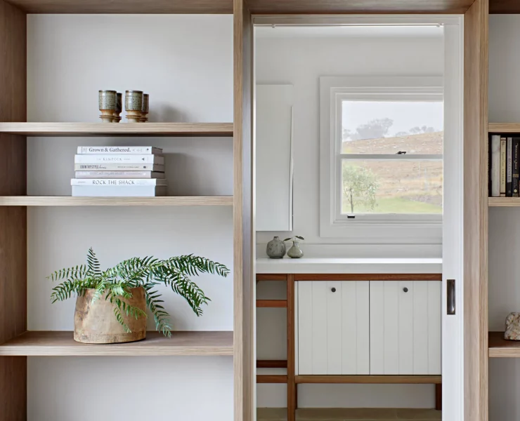 Bookcase wrapped around doorway