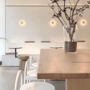 Decorative round wall lights above kitchen bench