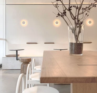 Decorative round wall lights above kitchen bench