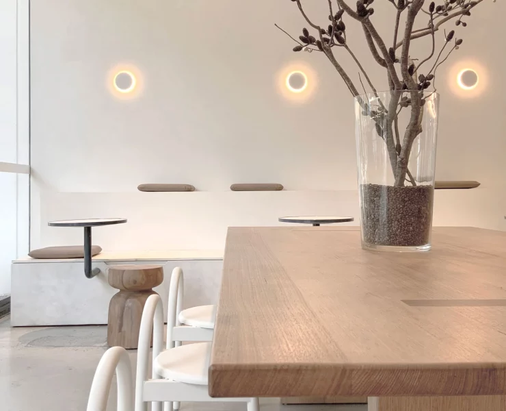 Decorative round wall lights above kitchen bench