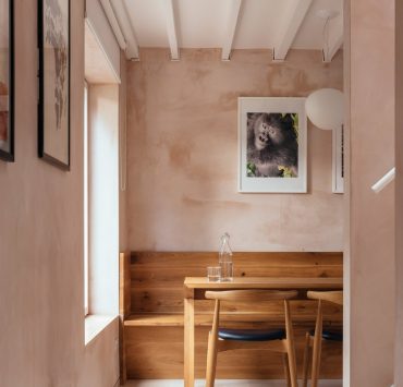 Light pink kitchen walls with warm woods